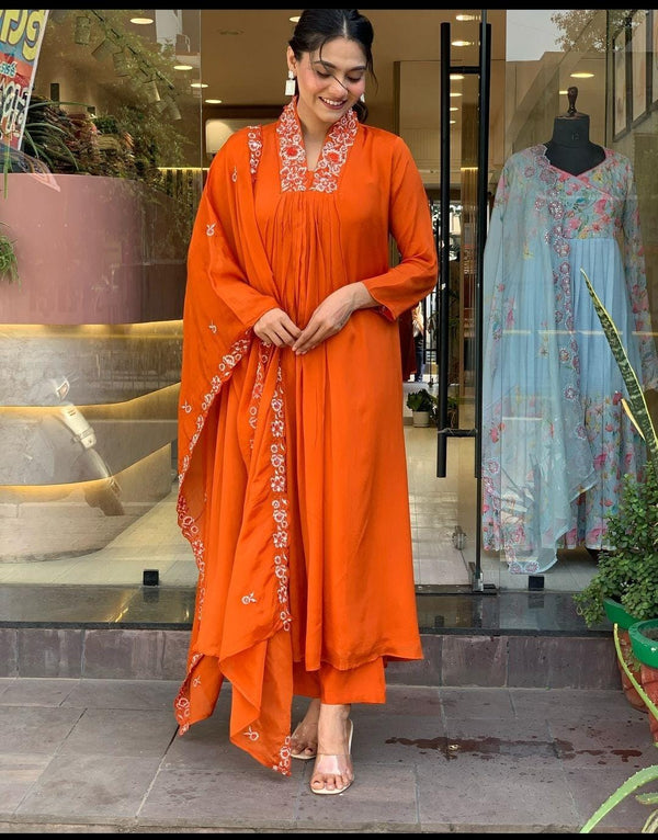 Orange Partywear Cotton Suit Set With Embroidery On Yoke