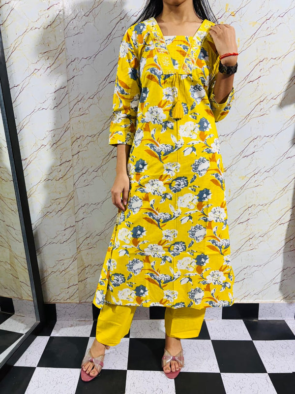 Yellow Vibrant Floral Printed Cotton Kurta Bottom Set With Front Tussles